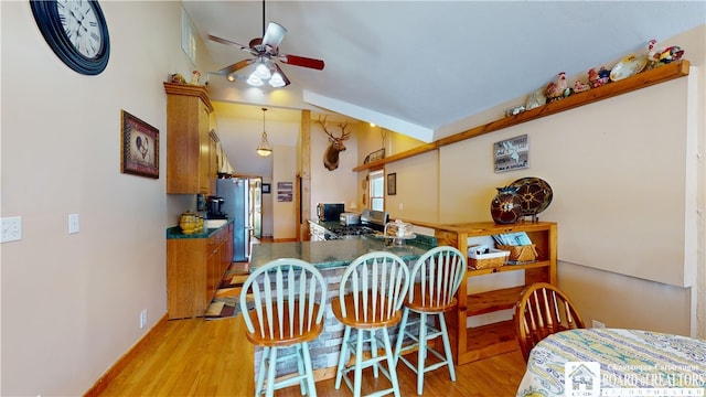 2638 Shadyside Rd, Mina, NY 14736 - dining room with light wood finished floors, baseboards, and ceiling fan