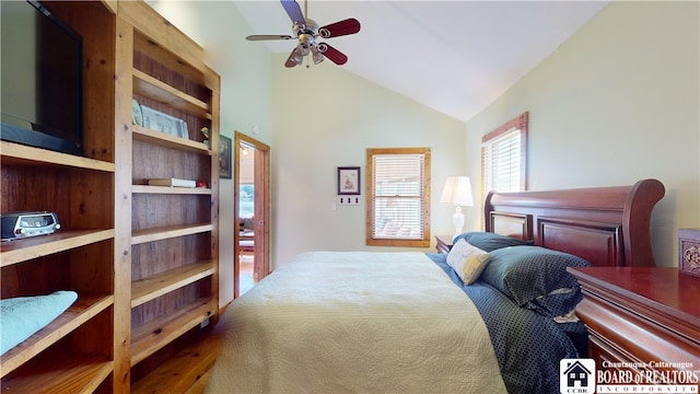 bedroom with ceiling fan and vaulted ceiling