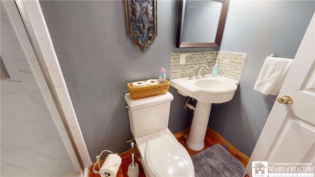 2638 Shadyside Rd, Mina, NY 14736 - bathroom featuring decorative backsplash, toilet, and walk in shower