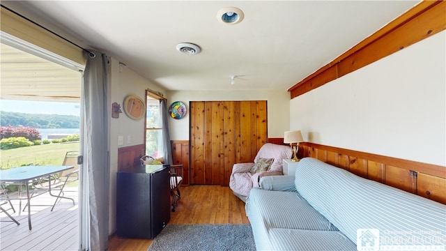 2638 Shadyside Rd, Mina, NY 14736 - bedroom featuring a wainscoted wall, visible vents, wood finished floors, access to outside, and wood walls