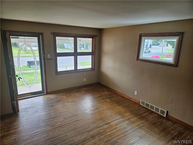 spare room featuring dark hardwood / wood-style floors