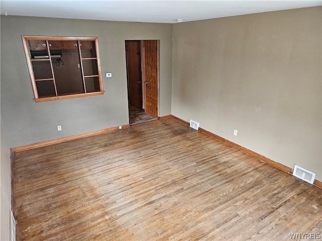 empty room featuring hardwood / wood-style floors