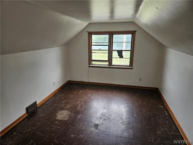 bonus room featuring lofted ceiling