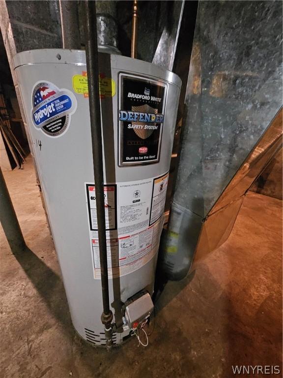 utility room with gas water heater