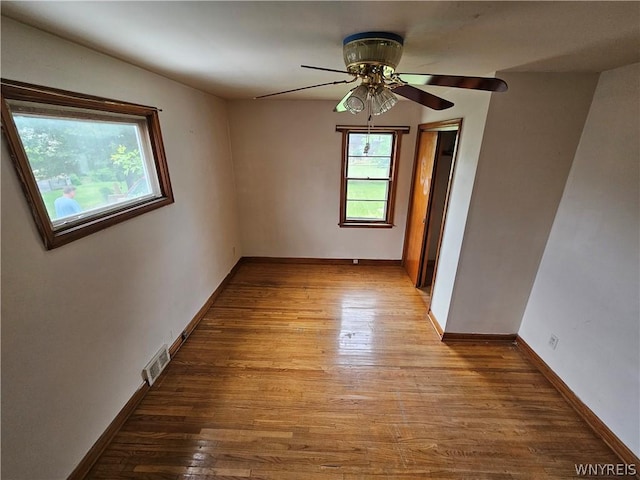 spare room featuring ceiling fan and light hardwood / wood-style flooring