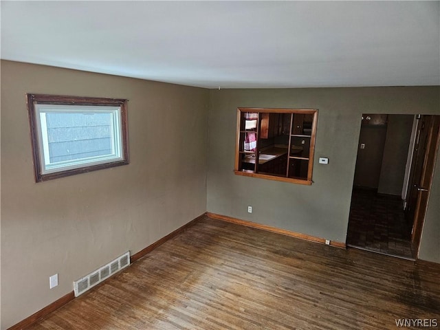 empty room featuring wood-type flooring