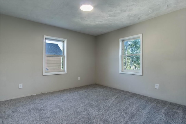 empty room with carpet flooring