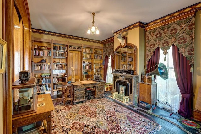 73 Elm St, Otsego, NY 13326 - office area featuring a chandelier, wood finished floors, and a fireplace