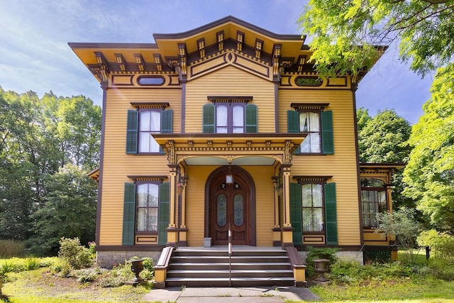 73 Elm St, Otsego, NY 13326 - italianate home featuring a porch