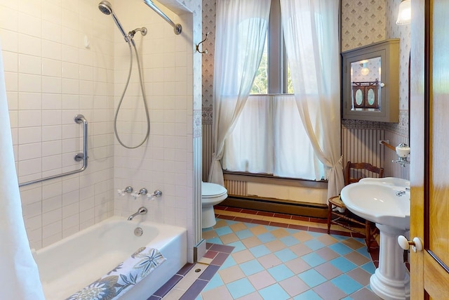 bathroom with tile flooring, shower / bath combo, and toilet