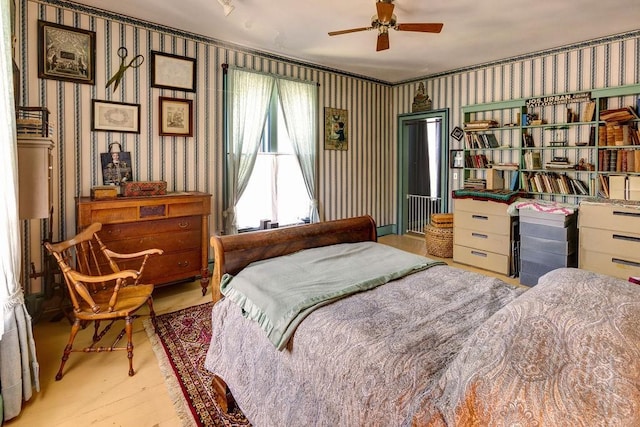 73 Elm St, Otsego, NY 13326 - bedroom featuring multiple windows, wood finished floors, and wallpapered walls