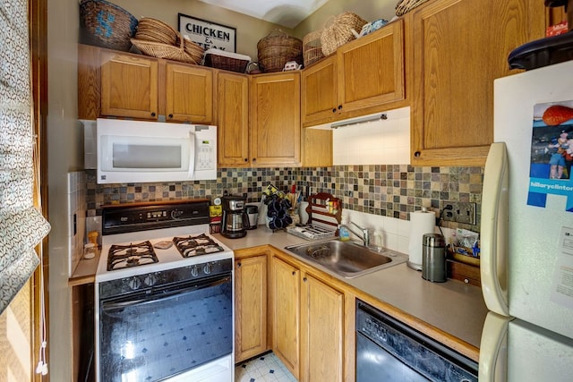 kitchen featuring backsplash, sink, white appliances, and light tile floors