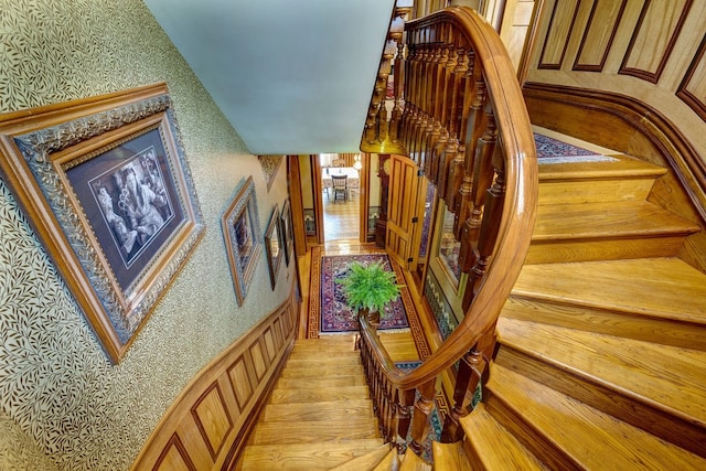 stairs with hardwood / wood-style flooring