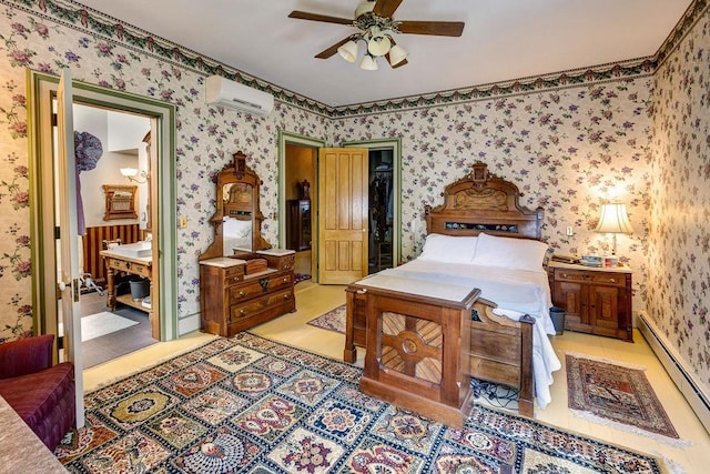 73 Elm St, Otsego, NY 13326 - bedroom featuring a baseboard heating unit, an AC wall unit, wallpapered walls, a ceiling fan, and ensuite bath