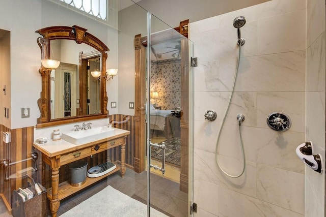 73 Elm St, Otsego, NY 13326 - bathroom with vanity, a wainscoted wall, and a stall shower