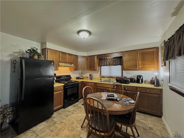 kitchen featuring sink and black appliances