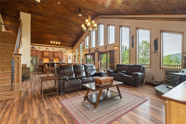 living room with dark hardwood / wood-style flooring, crown molding, wooden ceiling, a notable chandelier, and lofted ceiling