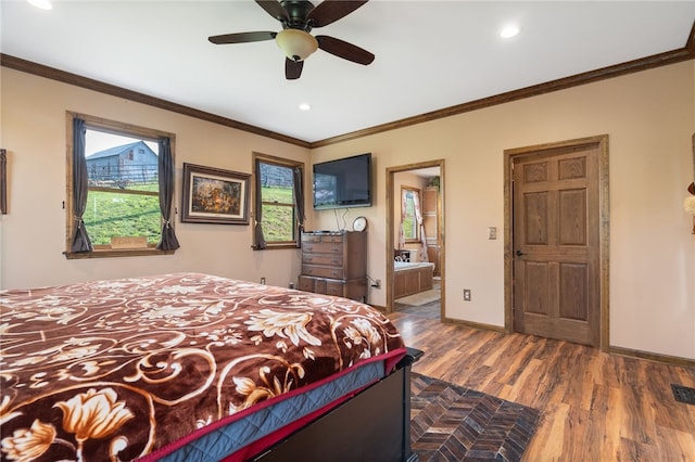 bedroom featuring hardwood / wood-style floors, ceiling fan, crown molding, and connected bathroom