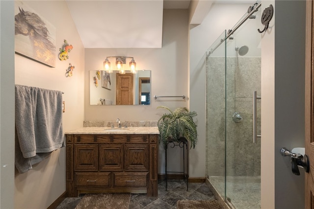 bathroom with vanity, vaulted ceiling, and an enclosed shower