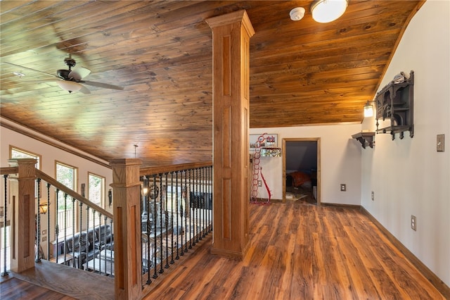 hallway with dark hardwood / wood-style flooring, wooden ceiling, and vaulted ceiling