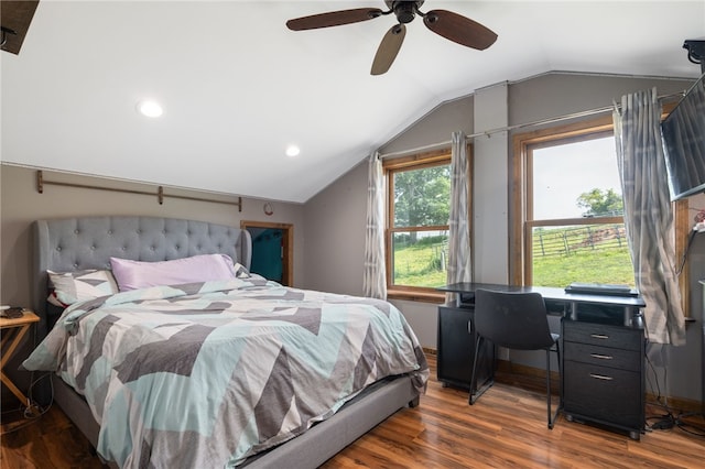 bedroom featuring ceiling fan, dark wood-type flooring, and vaulted ceiling