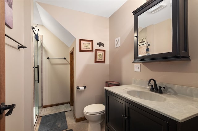 bathroom with walk in shower, vanity, and toilet