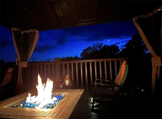 patio at twilight with an outdoor fire pit