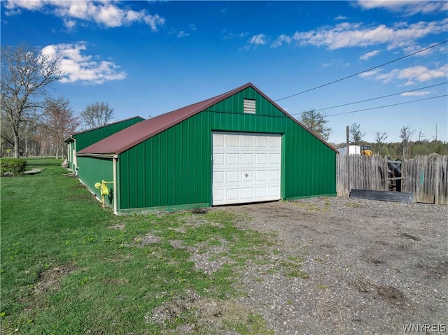 garage with a lawn