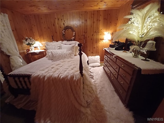 bedroom featuring wood ceiling and wooden walls