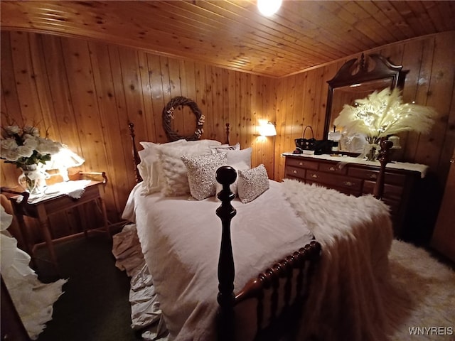 carpeted bedroom featuring wood ceiling and wooden walls