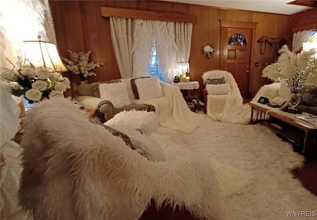 bedroom featuring wood walls