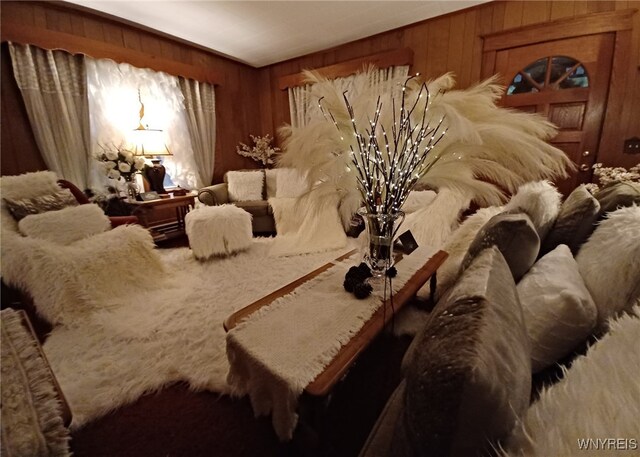 living room featuring wooden walls