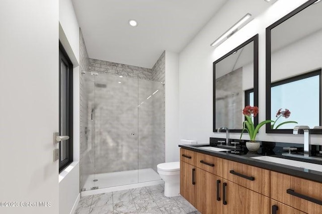 bathroom with vanity, toilet, and a shower with door