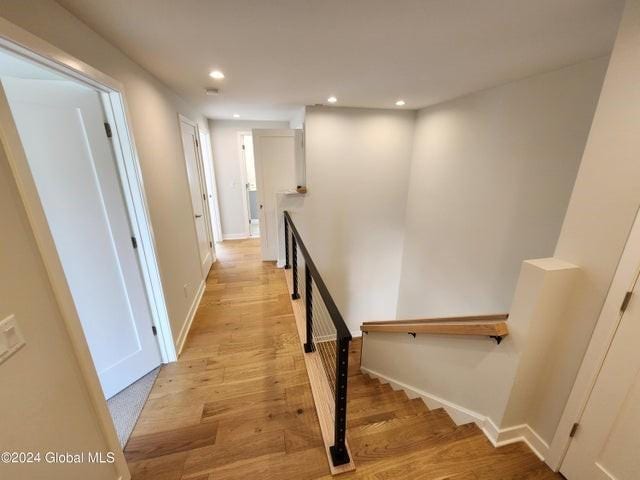 hall with light wood-type flooring