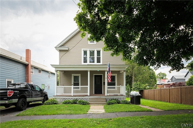 view of front facade featuring a porch and a front yard