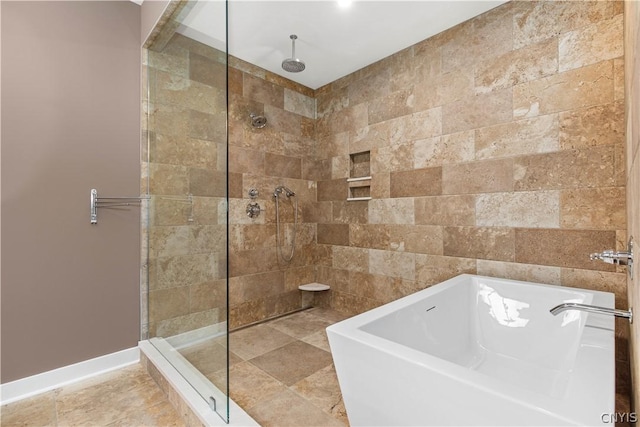 bathroom with separate shower and tub