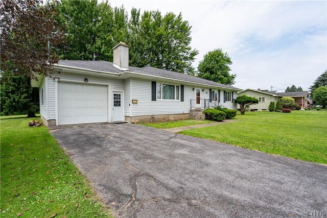 ranch-style house with a front lawn and a garage