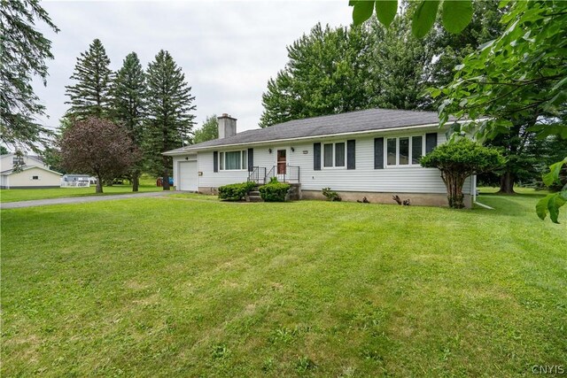 single story home featuring a front yard and a garage