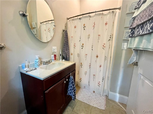 bathroom featuring vanity, curtained shower, and tile patterned flooring