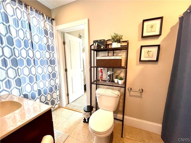 bathroom featuring vanity, toilet, and tile patterned floors