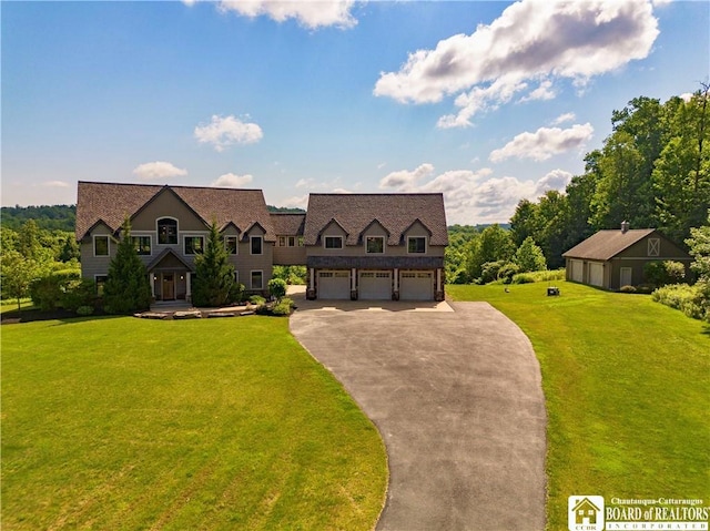 view of front of house featuring a front yard and a garage