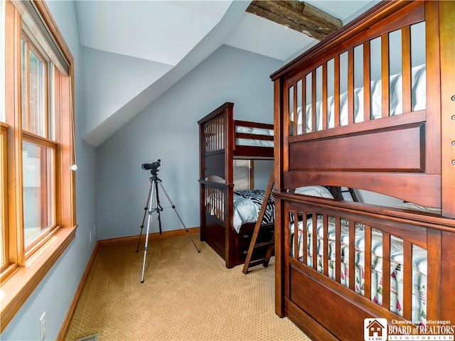 carpeted bedroom featuring lofted ceiling