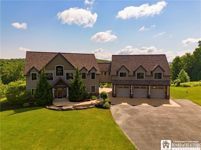 view of front facade featuring a front lawn and a garage