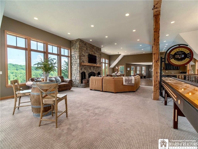 living room featuring a fireplace and light colored carpet