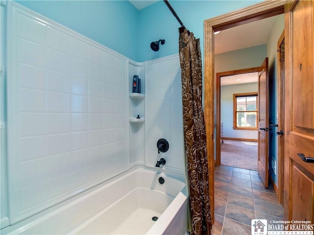 bathroom with shower / bathtub combination with curtain