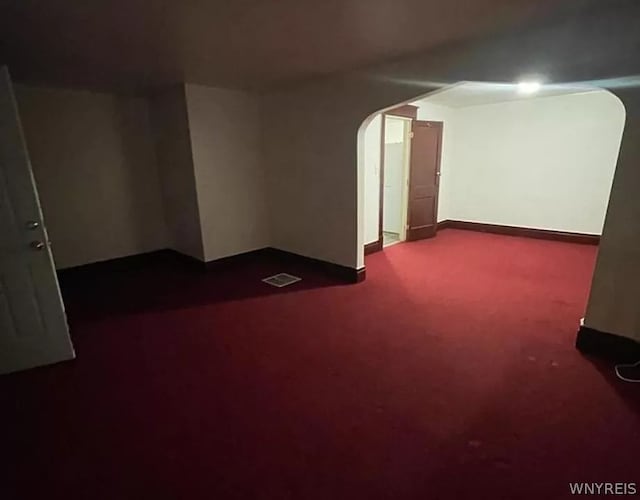 unfurnished room featuring carpet