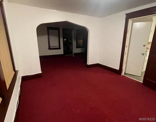 interior space with dark colored carpet