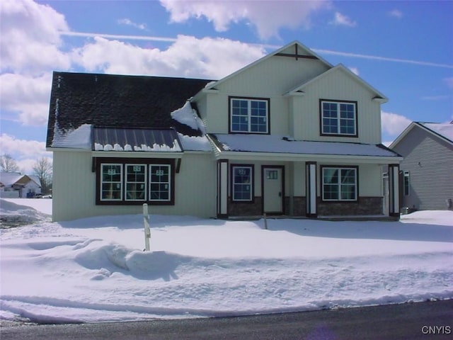 view of front of property with covered porch and metal roof