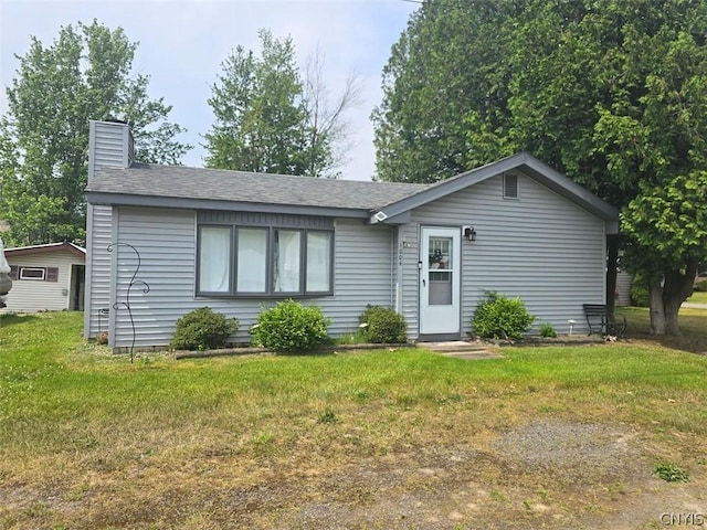 ranch-style home with a front lawn