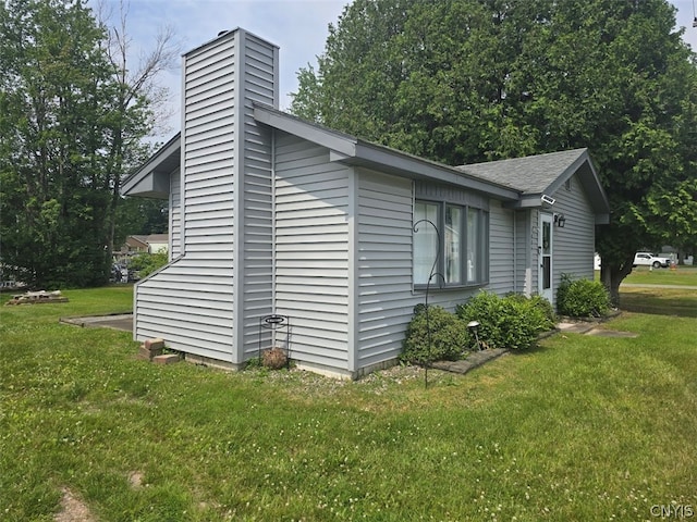 view of home's exterior featuring a lawn